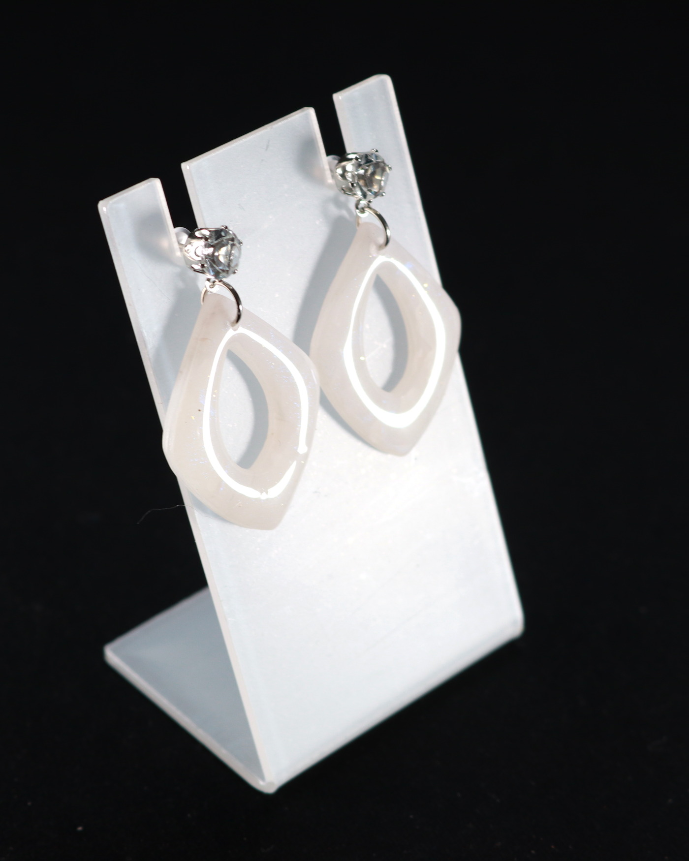 Ivory sculptural earrings in a tall editorial crop