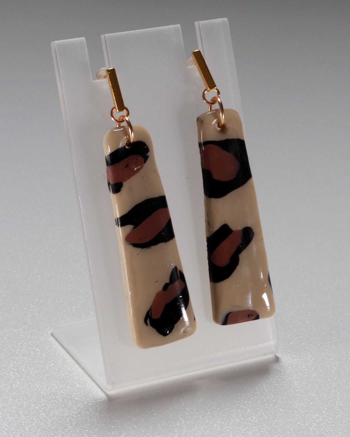 Leopard statement earrings shown as a balanced pair