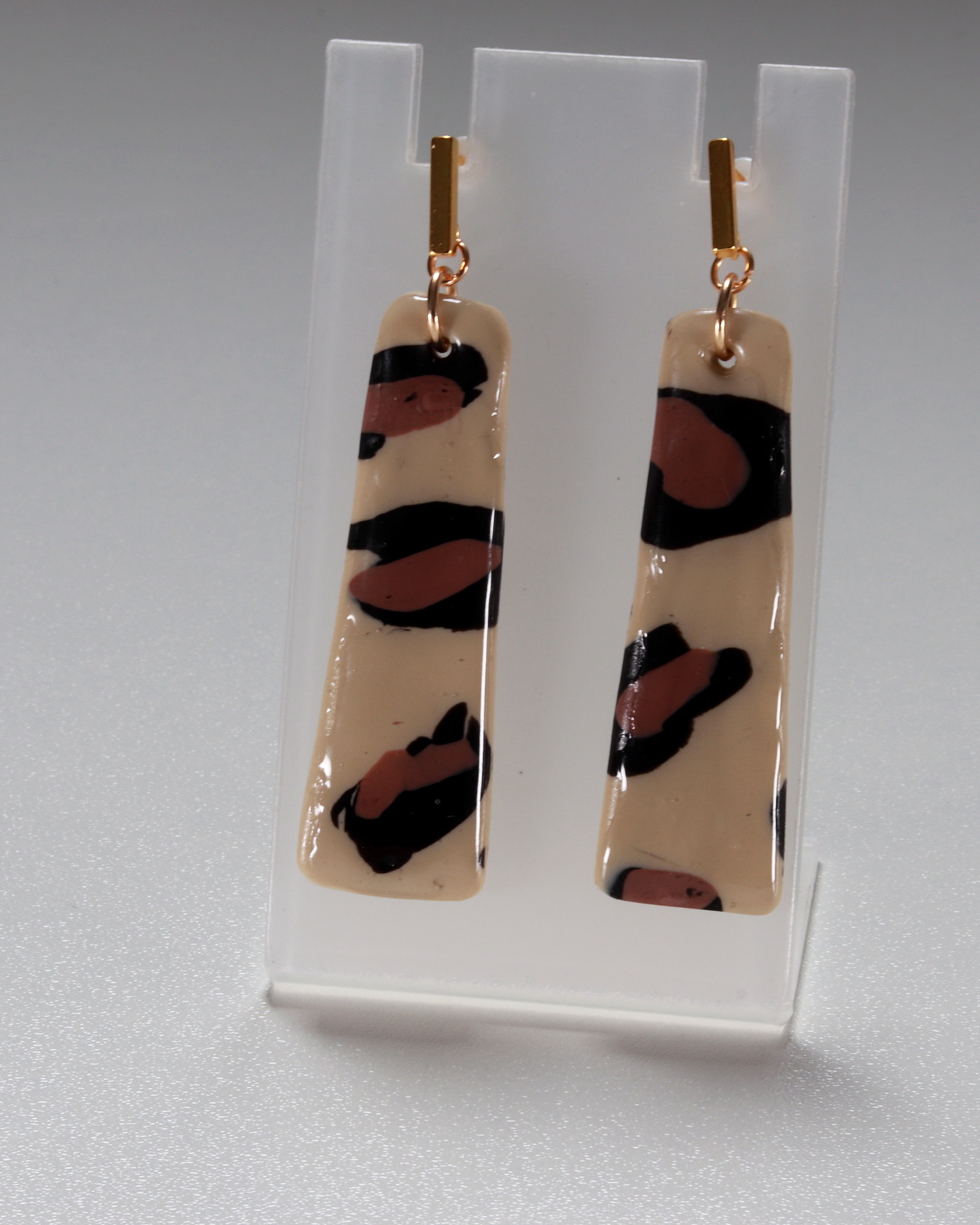 Leopard statement earrings in a close luxury reveal